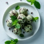 Mint chocolate chip protein bites arranged neatly on a plate