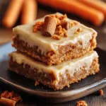 Freshly baked carrot bars cooling on a wire rack.