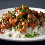 Overhead bowl of honey garlic chicken and rice.
